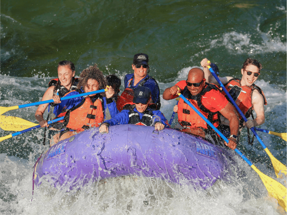 group-of-people-whitewater-rafting