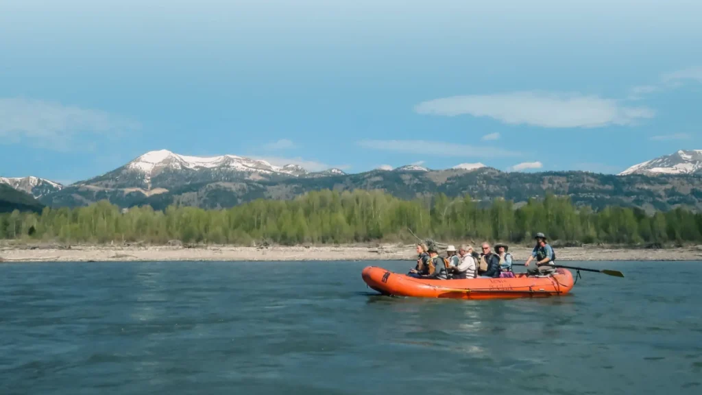 group-of-people-whitewater-rafting-scenic-float-trip